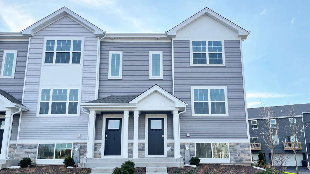 a front view of a house with a yard