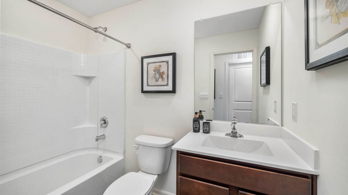 6530 Linden Trail, Unit B Wonder Lake, IL 60097 - Photo 9 of 13 a bathroom with a sink toilet and shower