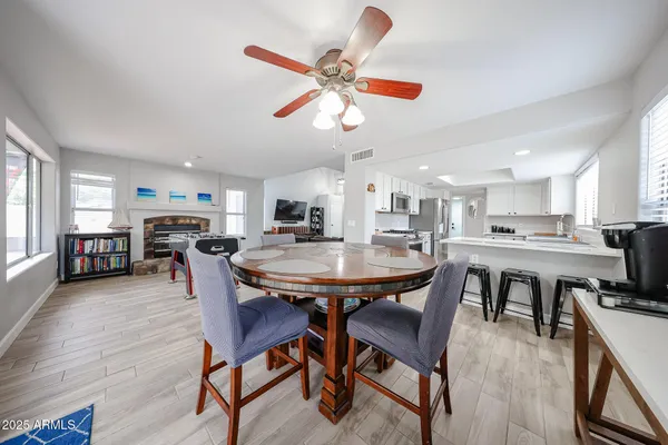 a dining room with furniture and window