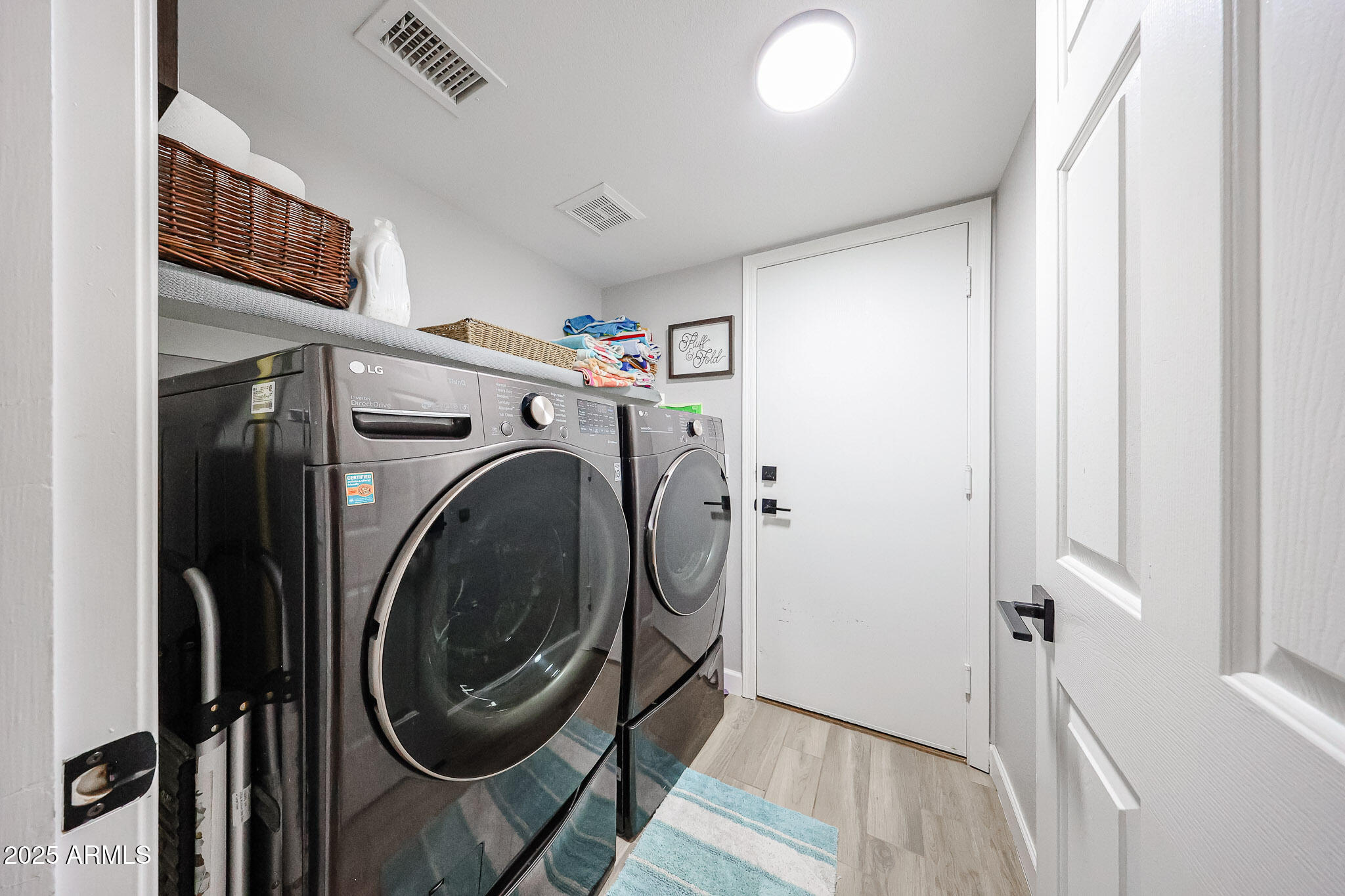 3902 East Rosemonte Drive Phoenix, AZ 85050 - Photo 19 of 46 a view of a hallway with washer and dryer