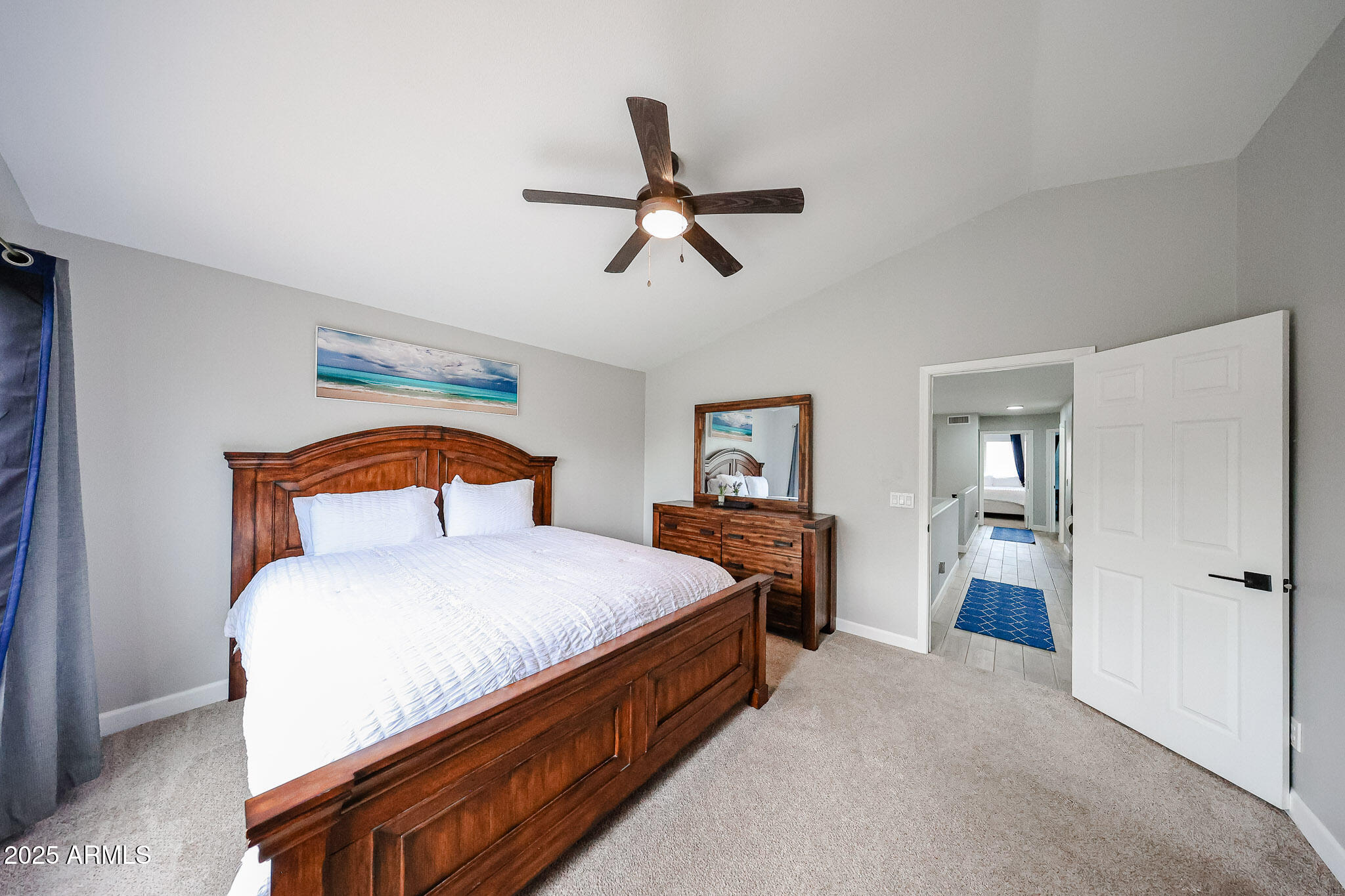 3902 East Rosemonte Drive Phoenix, AZ 85050 - Photo 21 of 46 a bedroom with a bed and a chandelier