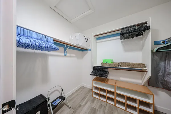 a view of a livingroom with furniture and a window