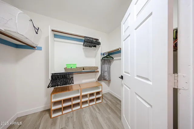 a view of entryway with wooden floor and stairs