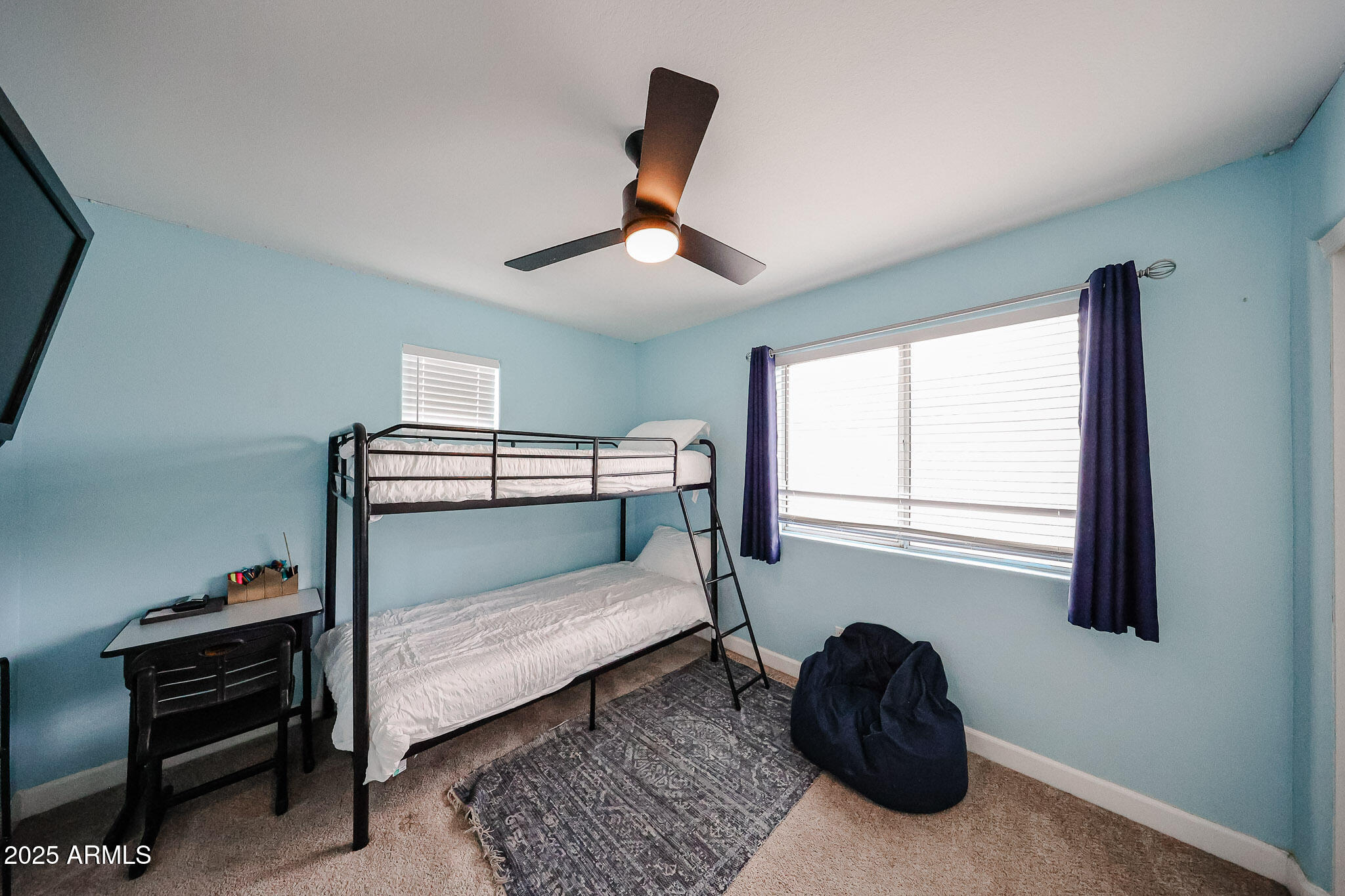 3902 East Rosemonte Drive Phoenix, AZ 85050 - Photo 28 of 46 a bedroom with a bed and a window
