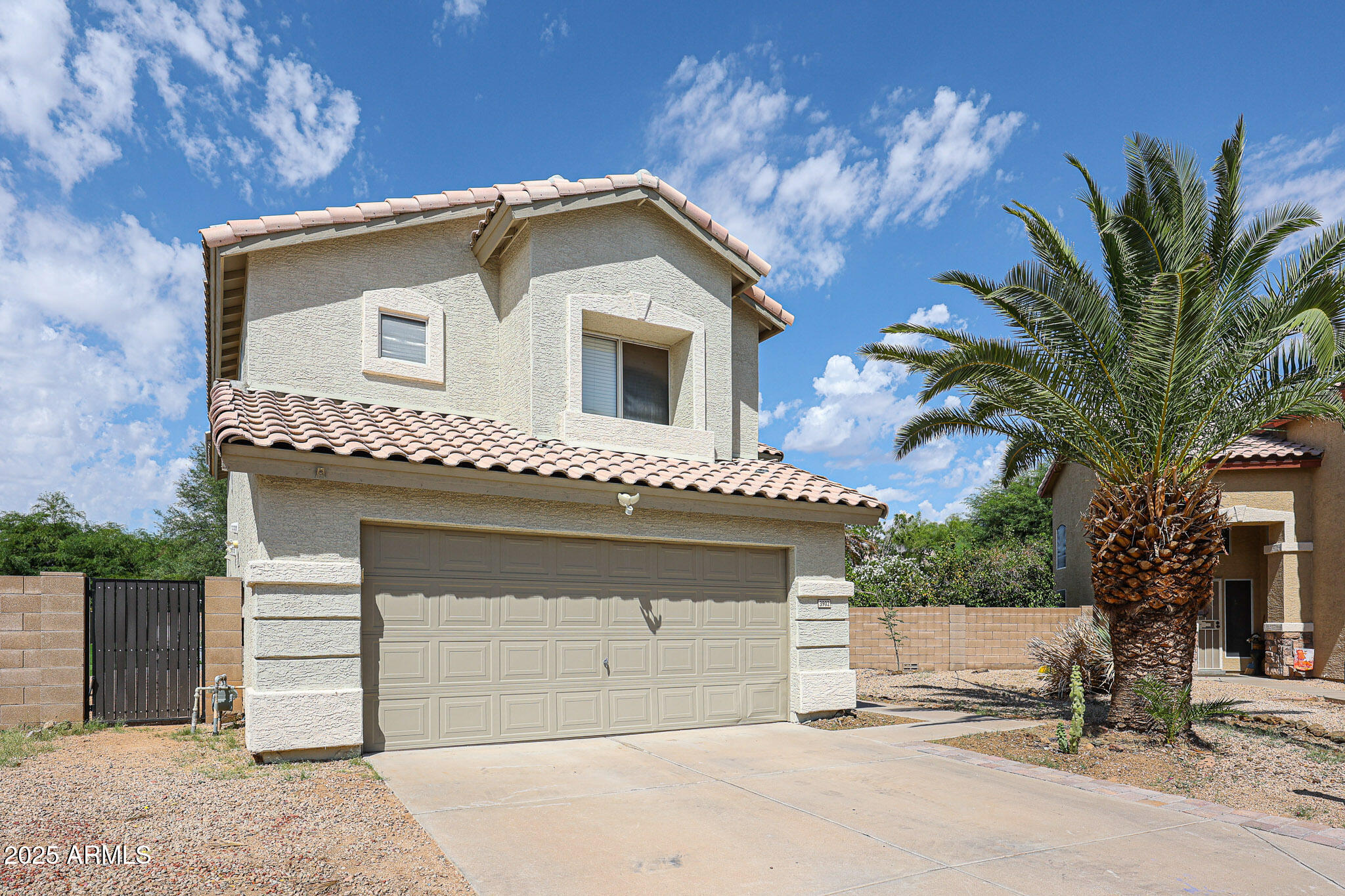3902 East Rosemonte Drive Phoenix, AZ 85050 - Photo 3 of 46 a front view of a house with a garage