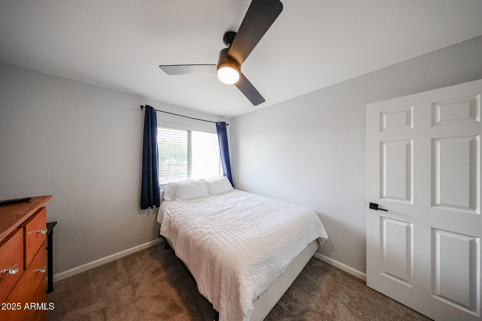 3902 East Rosemonte Drive Phoenix, AZ 85050 - Photo 32 of 46 a bedroom with a bed and a window