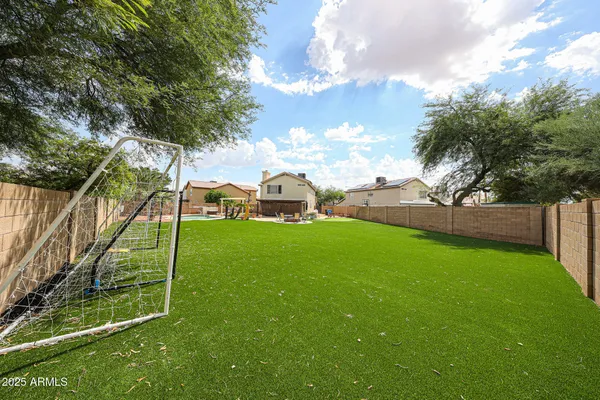 a view of a playground with basketball court
