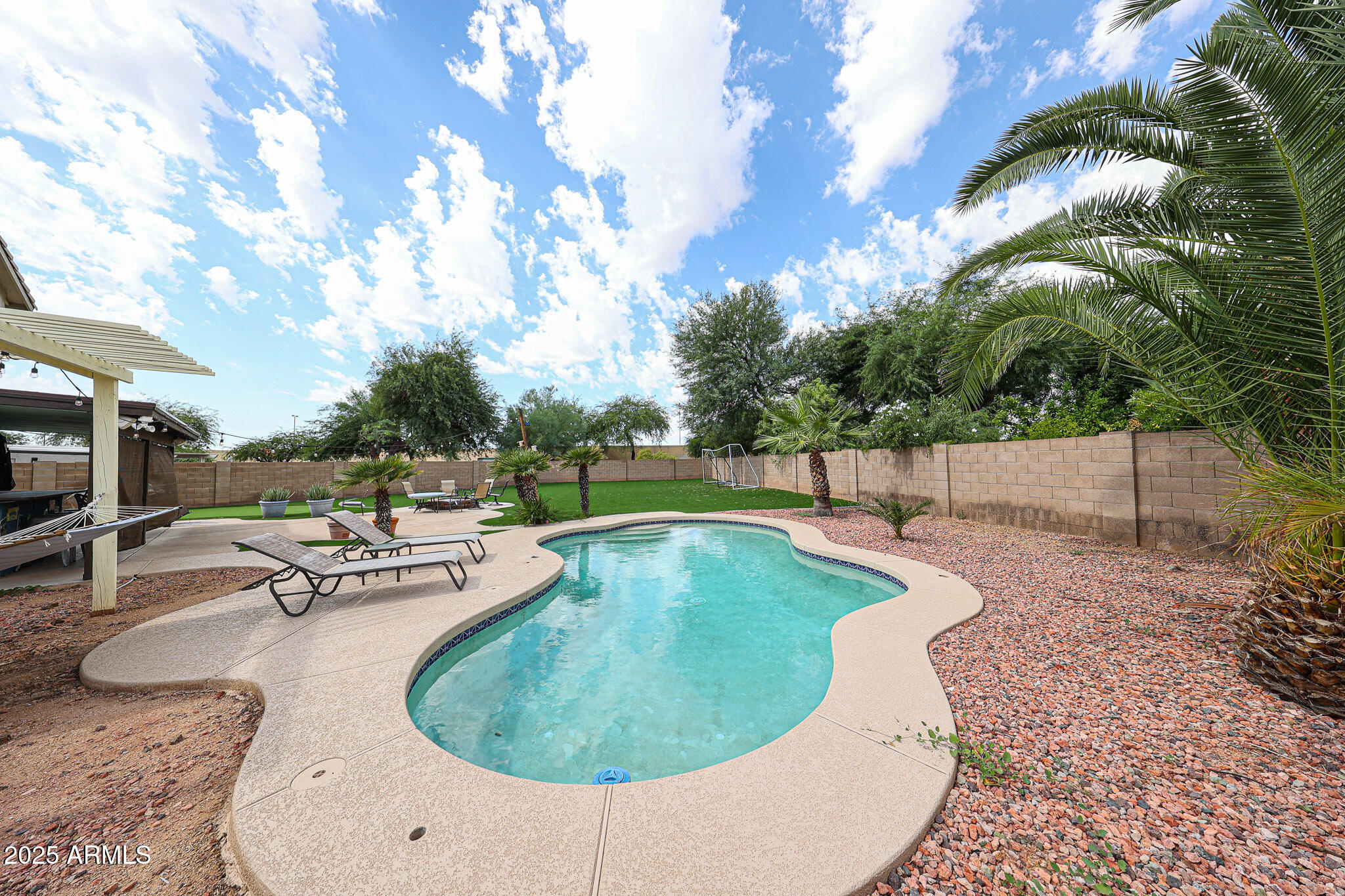 3902 East Rosemonte Drive Phoenix, AZ 85050 - Photo 42 of 46 a view of a swimming pool with a patio