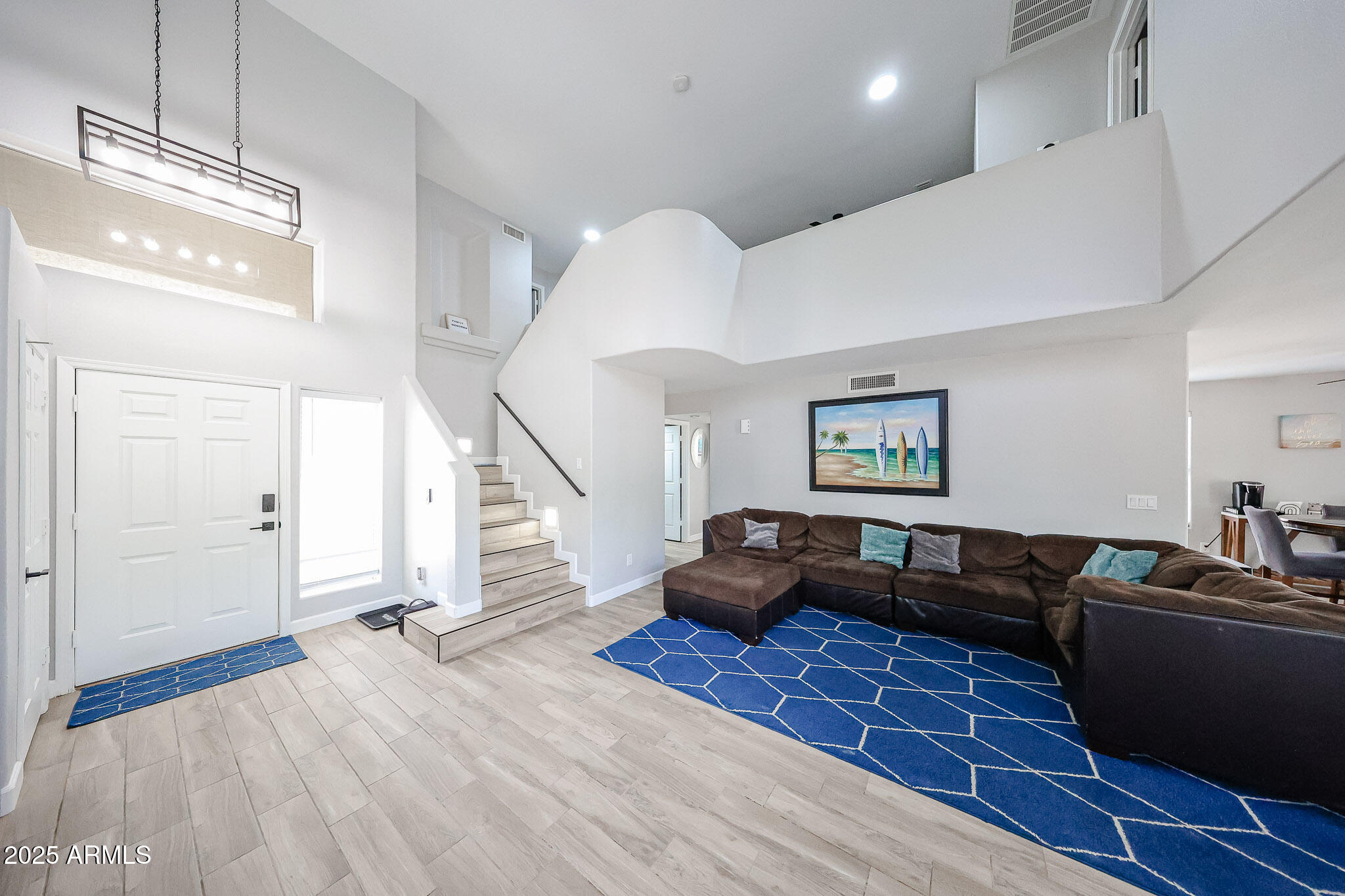 3902 East Rosemonte Drive Phoenix, AZ 85050 - Photo 6 of 46 a living room with furniture and a wooden floor