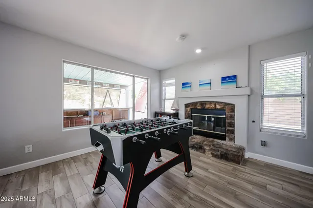 a livingroom with furniture window and wooden floor
