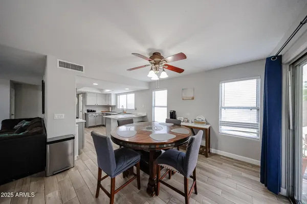 a view of a dining room with furniture window and wooden floor