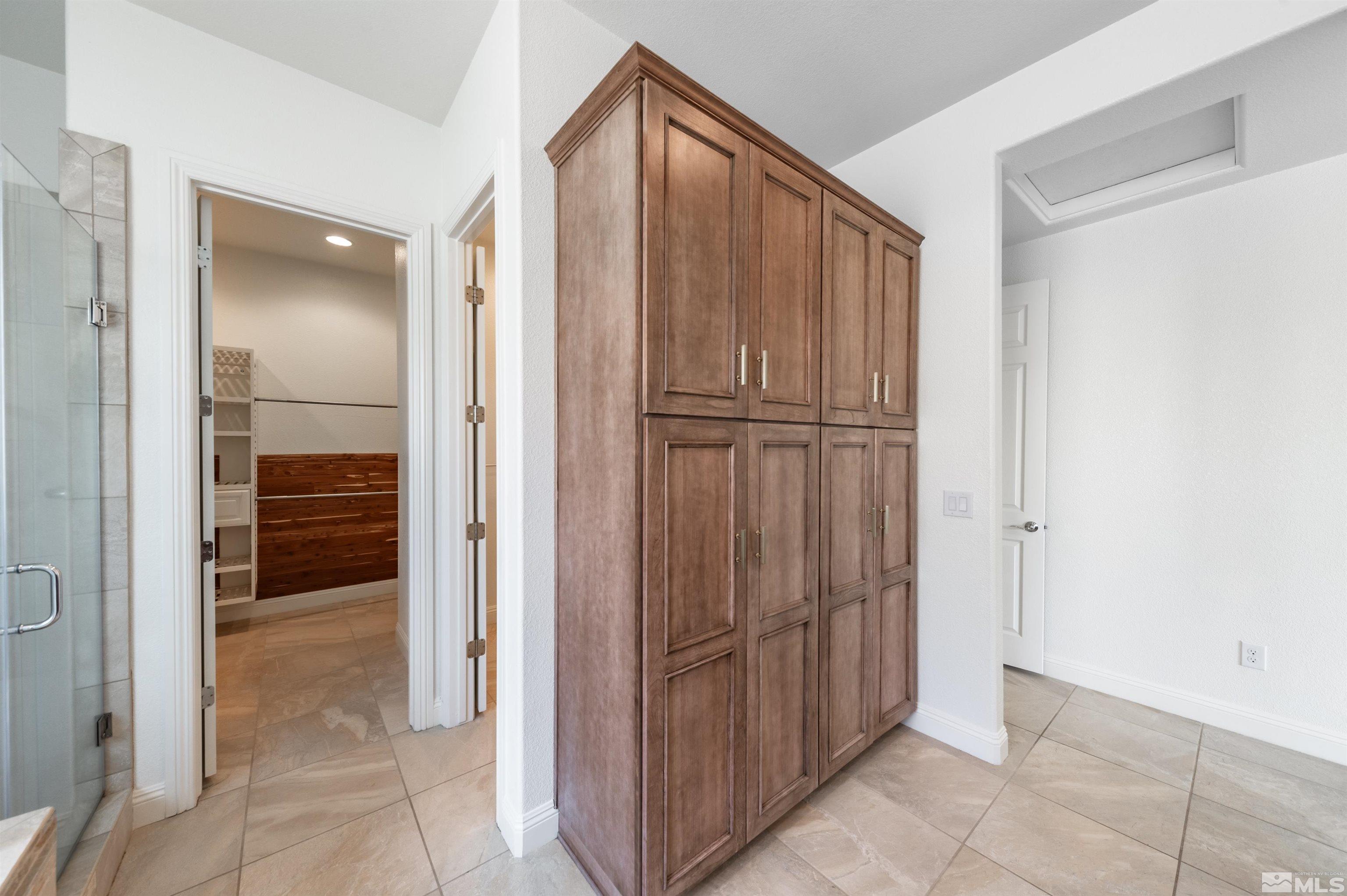 10065 Ellis Park Lane Reno, NV 89521 - Photo 19 of 30 a view of a hallway with some rooms