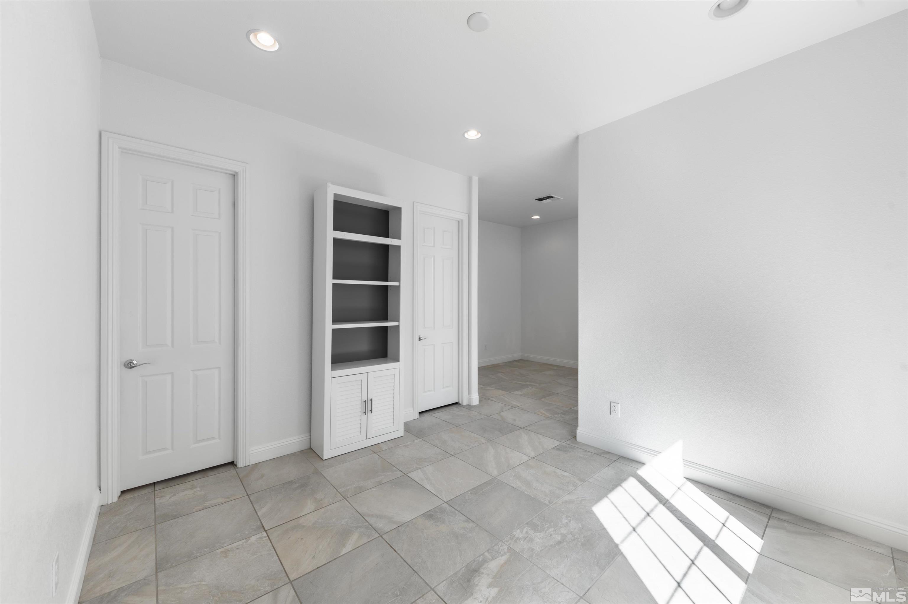 10065 Ellis Park Lane Reno, NV 89521 - Photo 23 of 30 an empty room with a empty space and windows