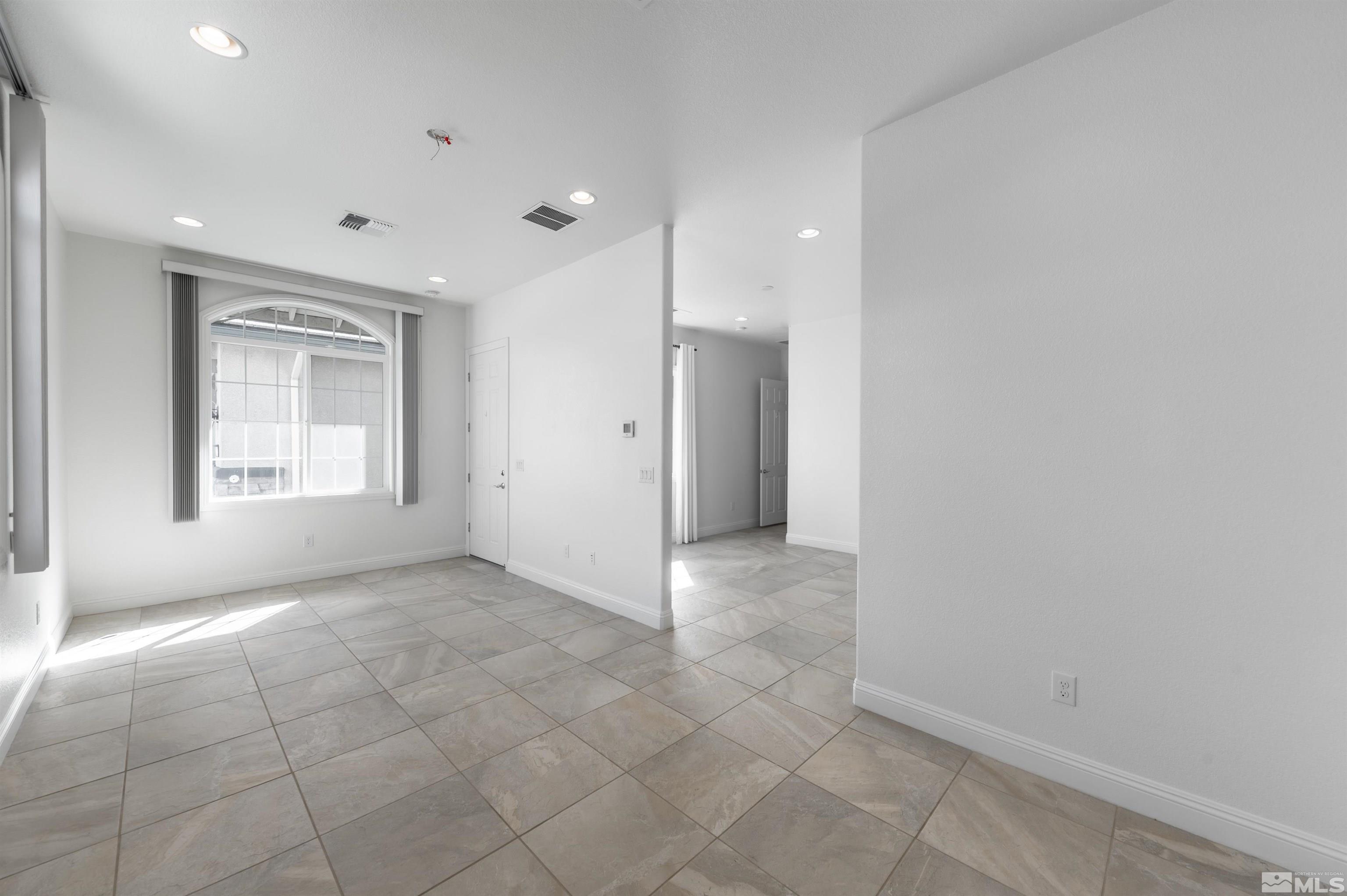 10065 Ellis Park Lane Reno, NV 89521 - Photo 24 of 30 a view of an empty room with a window