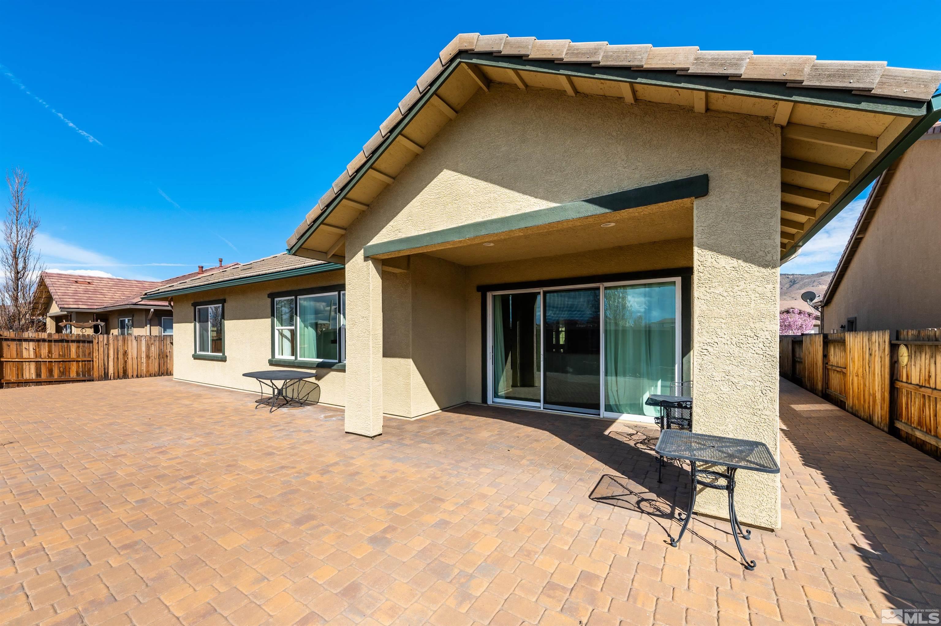 10065 Ellis Park Lane Reno, NV 89521 - Photo 29 of 30 a view of a house with backyard and porch