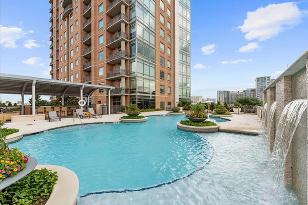 a view of swimming pool and outdoor seating