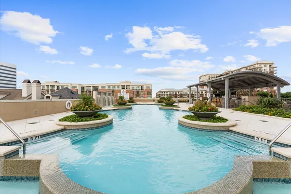 a view of a swimming pool with a patio