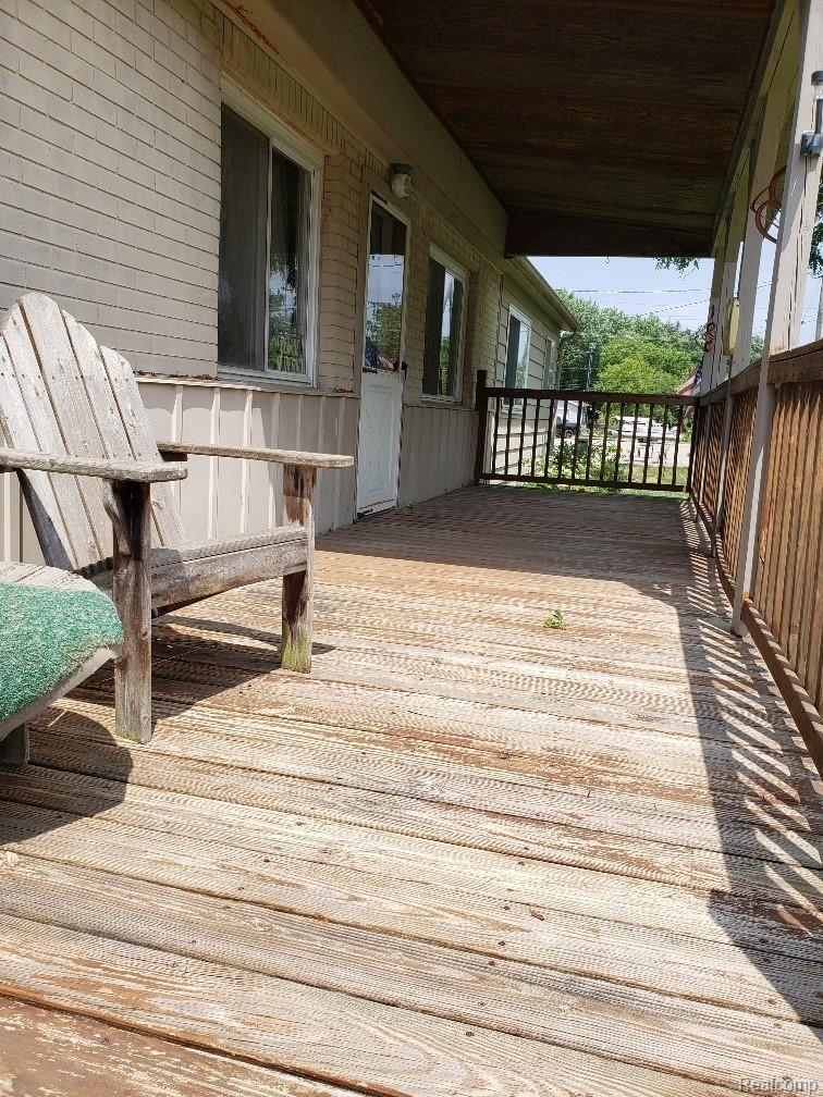 5485 North Irish Road Davison, MI 48423 - Photo 3 of 6 Extra large covered front porch, admire the pine trees across the street