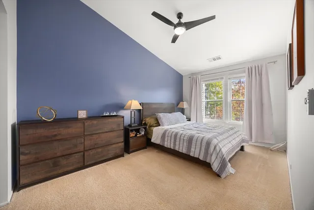 a bedroom with a bed and window