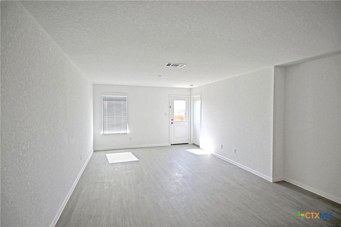 11560 Chestnut Rose St. Hedwig, TX 78152 - Photo 16 of 28 a view of an empty room with a window