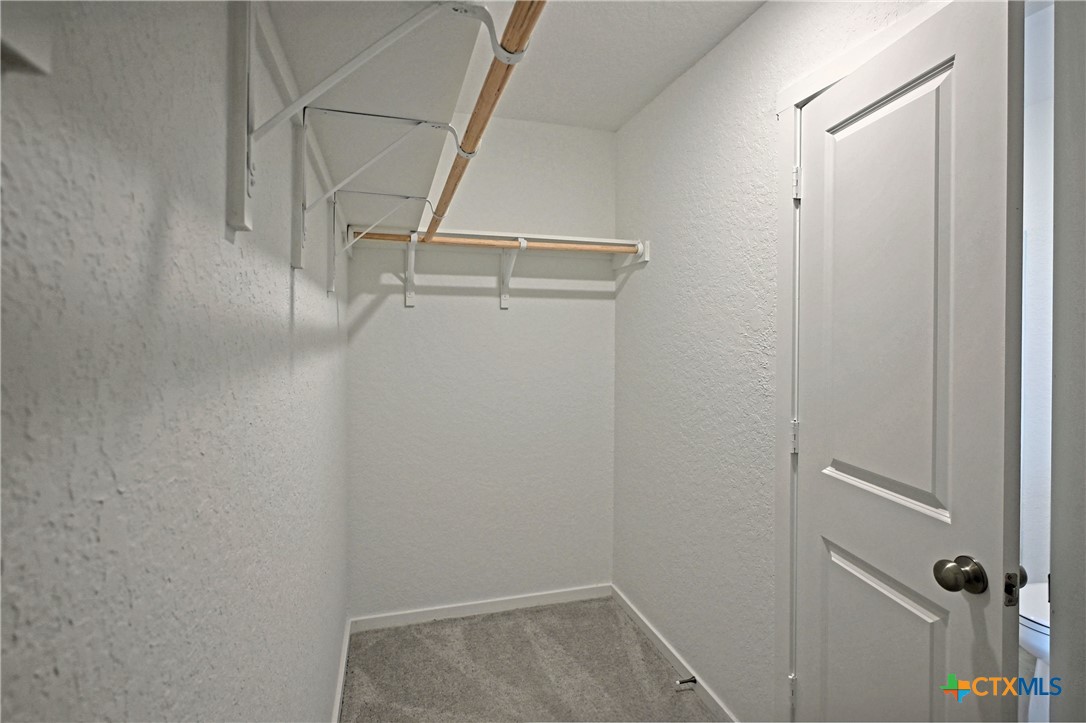 11560 Chestnut Rose St. Hedwig, TX 78152 - Photo 22 of 28 a view of walk in closet