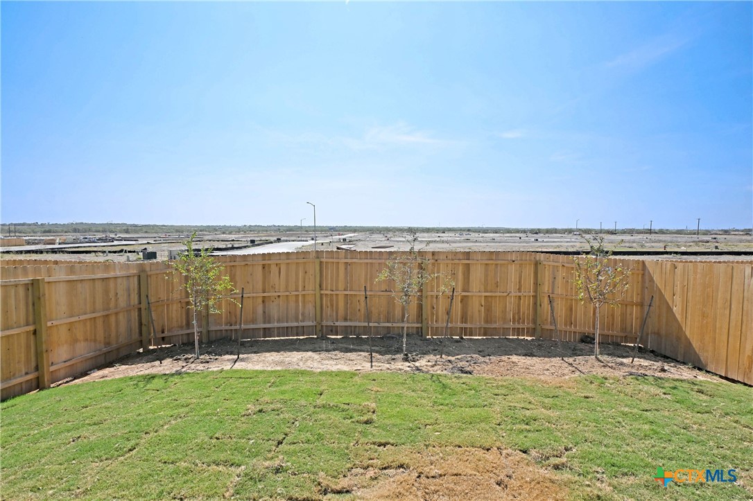 11560 Chestnut Rose St. Hedwig, TX 78152 - Photo 24 of 28 a view of a lake with a big yard
