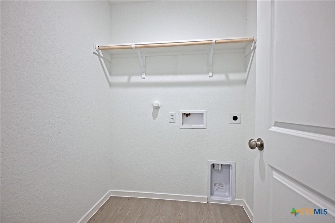 11560 Chestnut Rose St. Hedwig, TX 78152 - Photo 3 of 28 a view of small space with racks on the wall