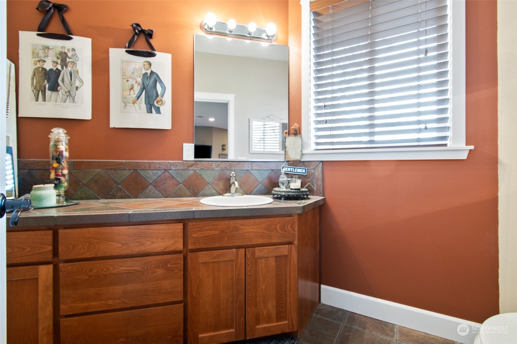 6504 263rd Street East Graham, WA 98338 - Photo 11 of 38 a bathroom with a sink and a mirror
