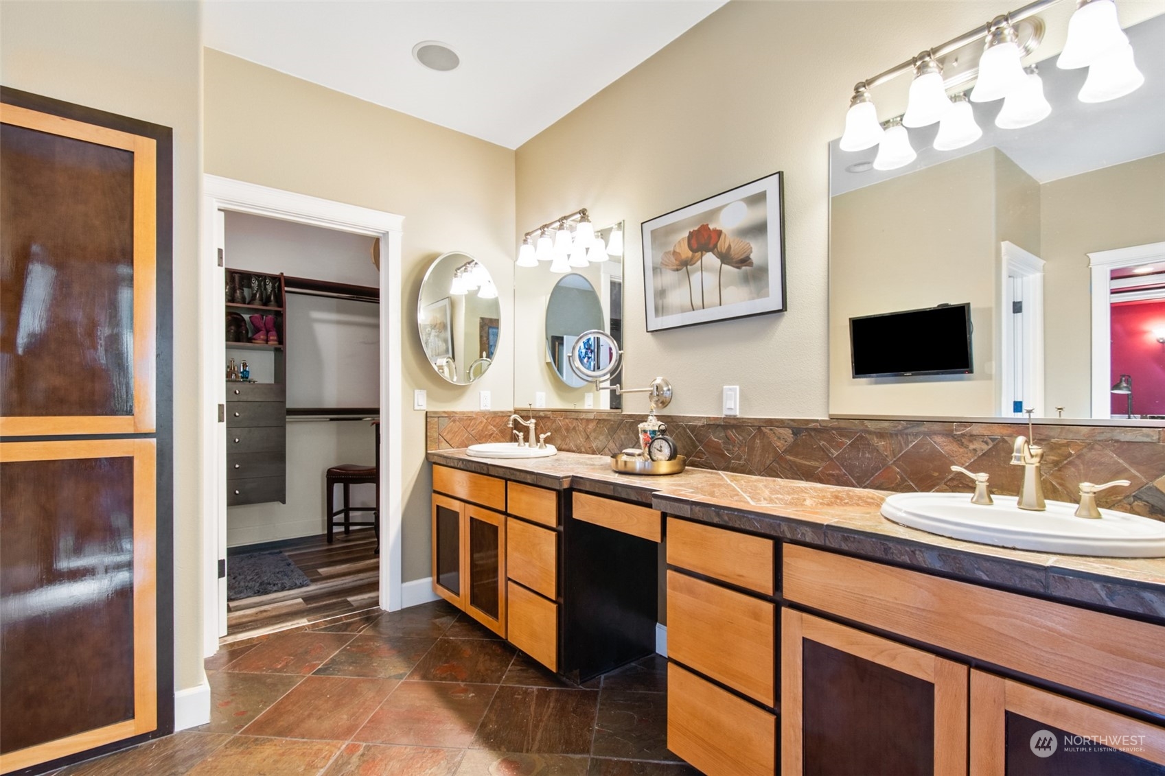 6504 263rd Street East Graham, WA 98338 - Photo 13 of 38 a bathroom with a double vanity sink and a mirror