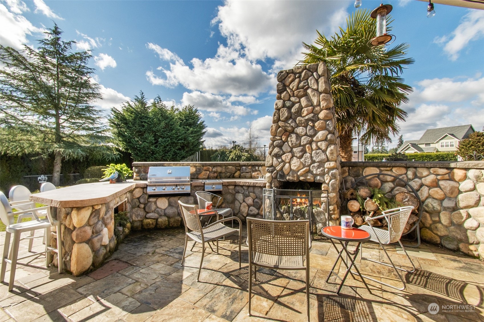 6504 263rd Street East Graham, WA 98338 - Photo 22 of 38 a view of terrace with seating area and barbeque oven