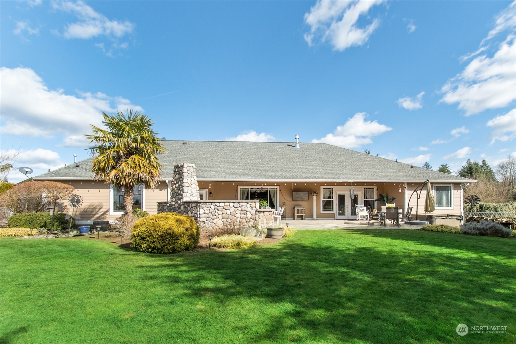 6504 263rd Street East Graham, WA 98338 - Photo 23 of 38 a front view of a house with garden