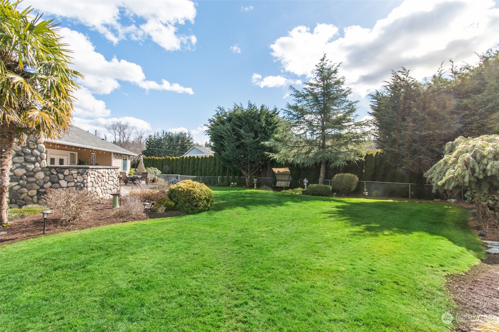 6504 263rd Street East Graham, WA 98338 - Photo 24 of 38 a view of a house with backyard