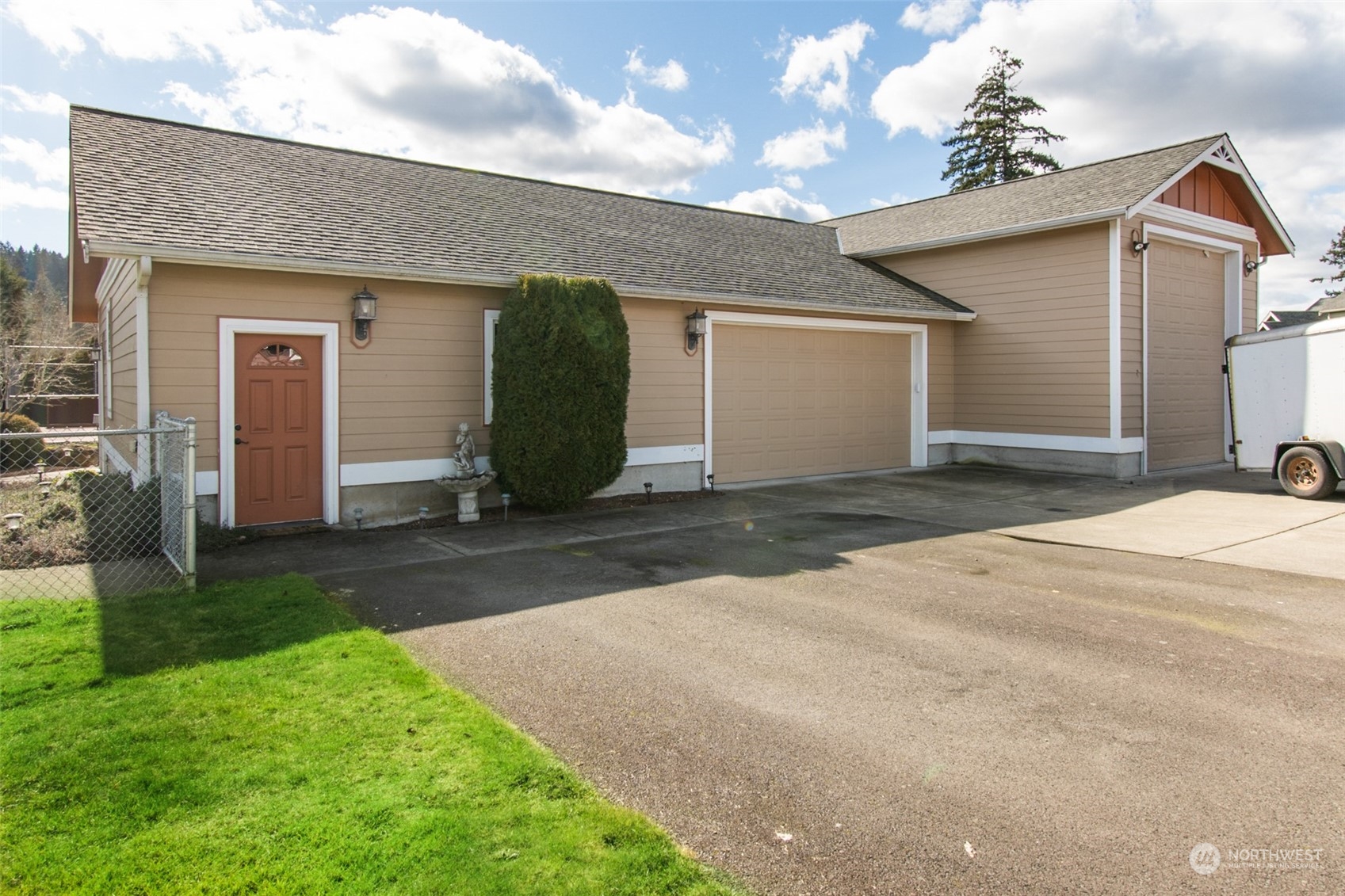 6504 263rd Street East Graham, WA 98338 - Photo 30 of 38 a view of a house with yard and a garage