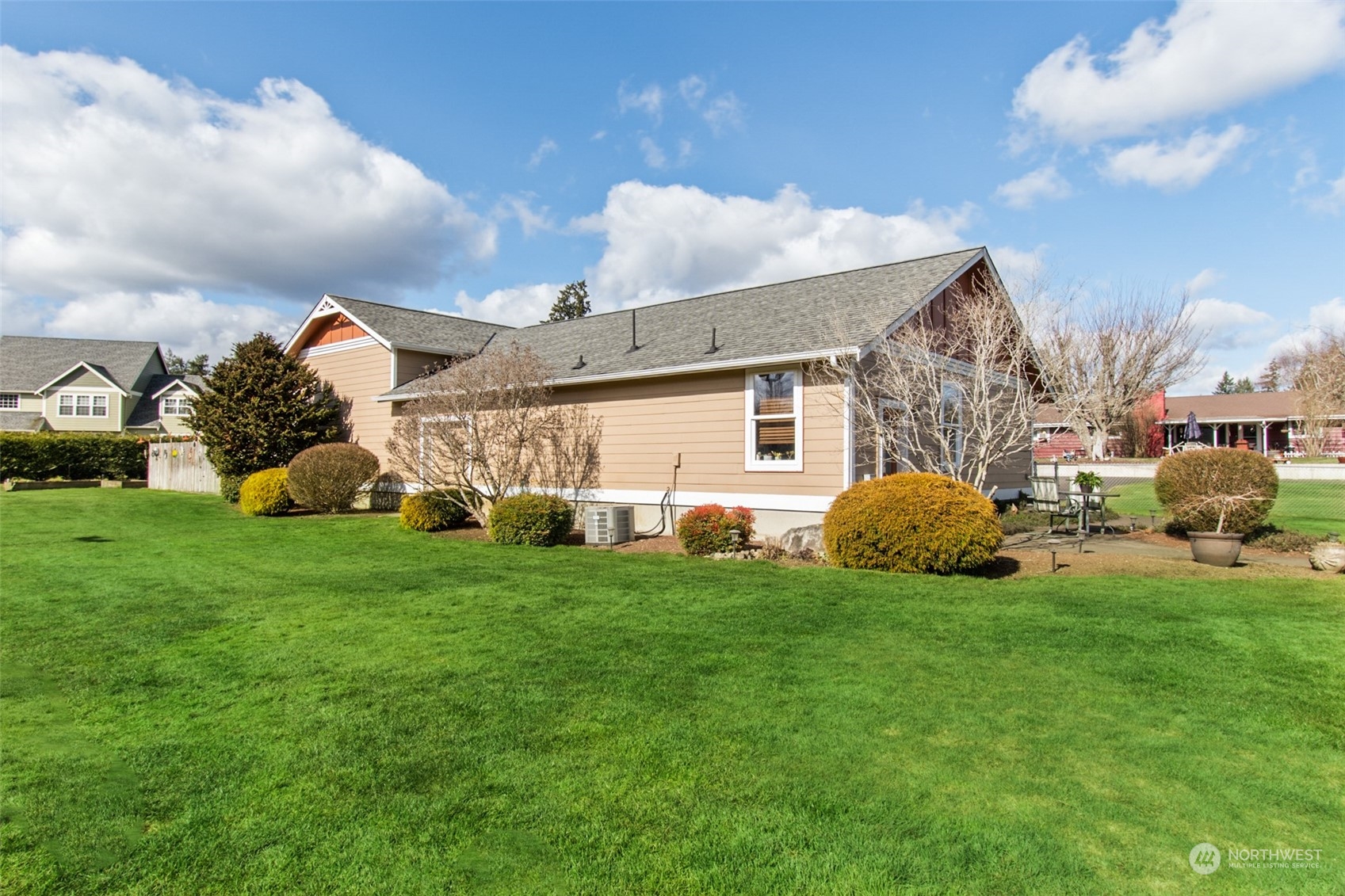 6504 263rd Street East Graham, WA 98338 - Photo 31 of 38 a view of a house with a big yard and large trees