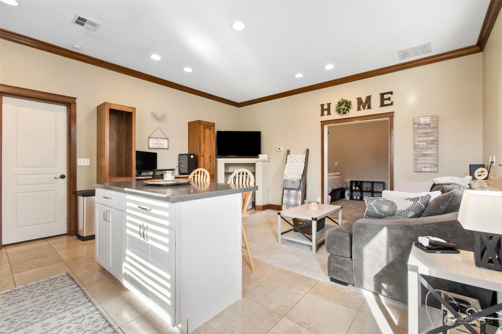 6504 263rd Street East Graham, WA 98338 - Photo 33 of 38 a living room with fireplace furniture and a flat screen tv