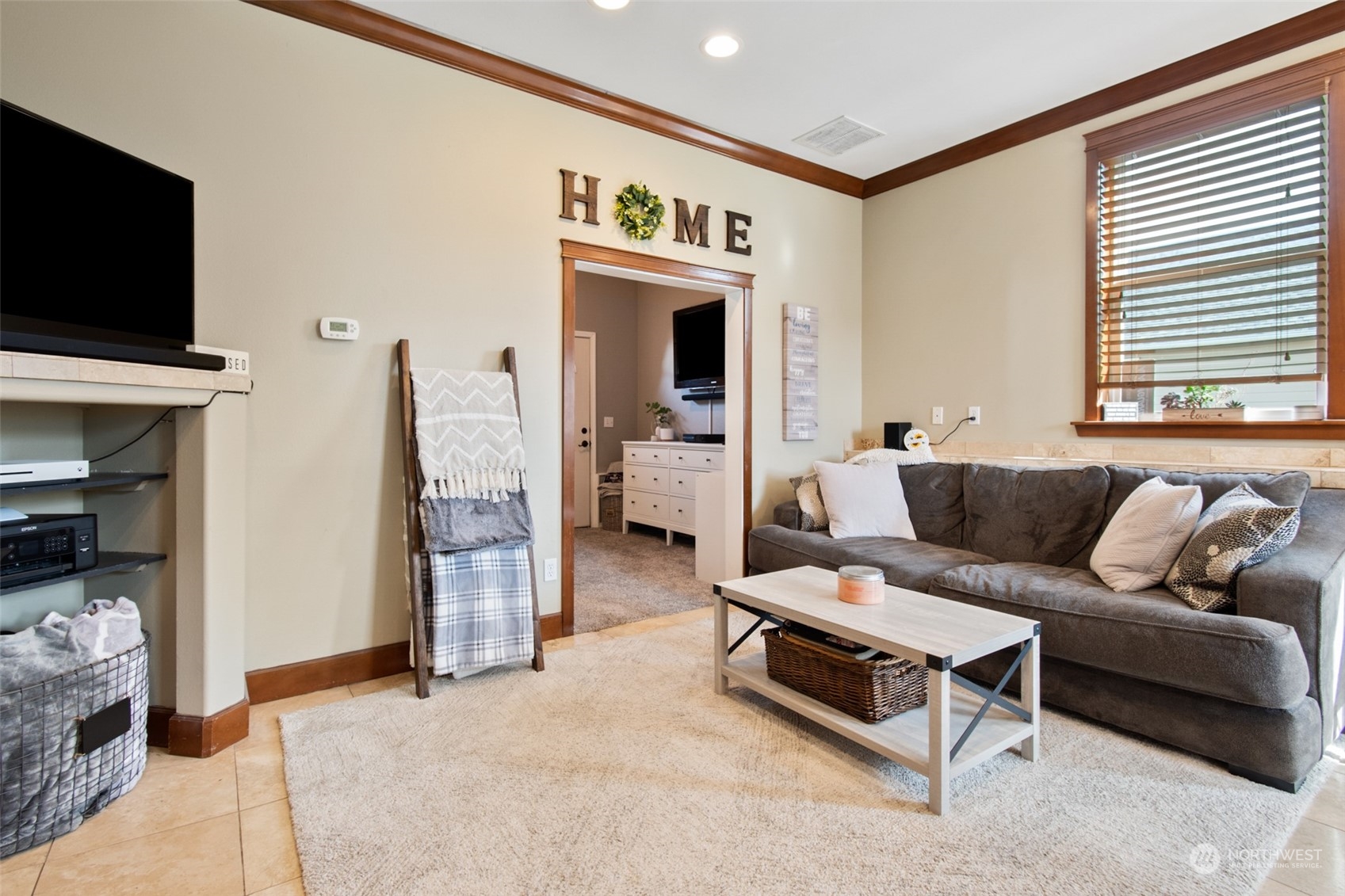6504 263rd Street East Graham, WA 98338 - Photo 35 of 38 a living room with furniture and a flat screen tv