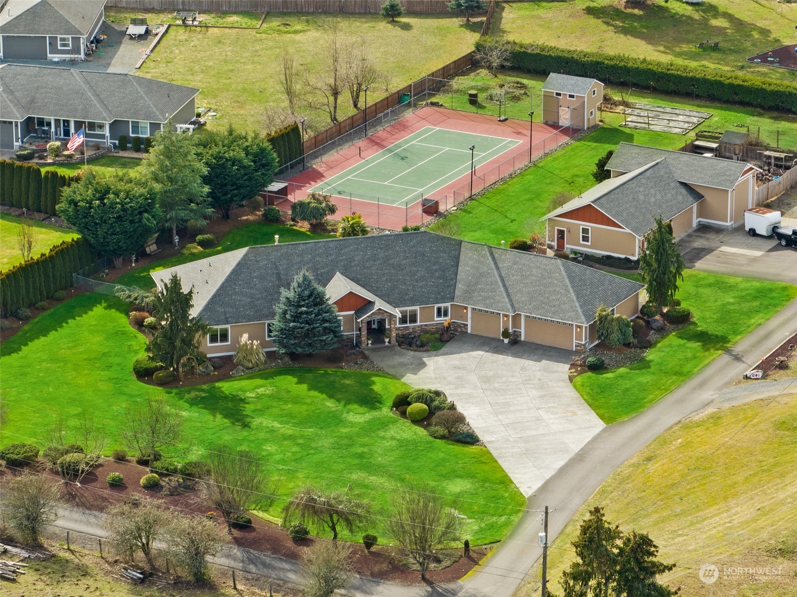 6504 263rd Street East Graham, WA 98338 - Photo 38 of 38 an aerial view of a house with swimming pool patio and outdoor seating