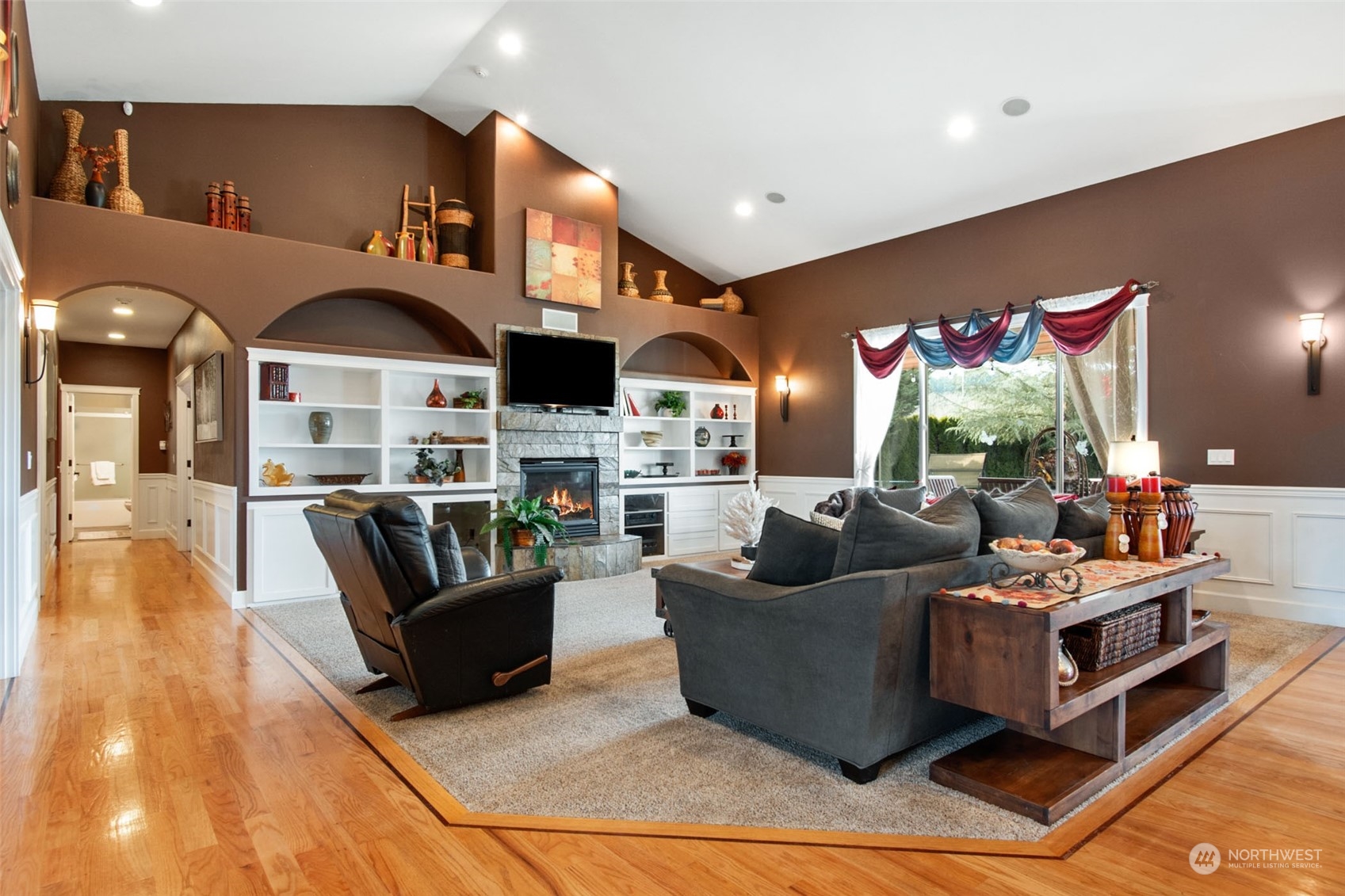 6504 263rd Street East Graham, WA 98338 - Photo 5 of 38 a living room with fireplace furniture and a wooden floor
