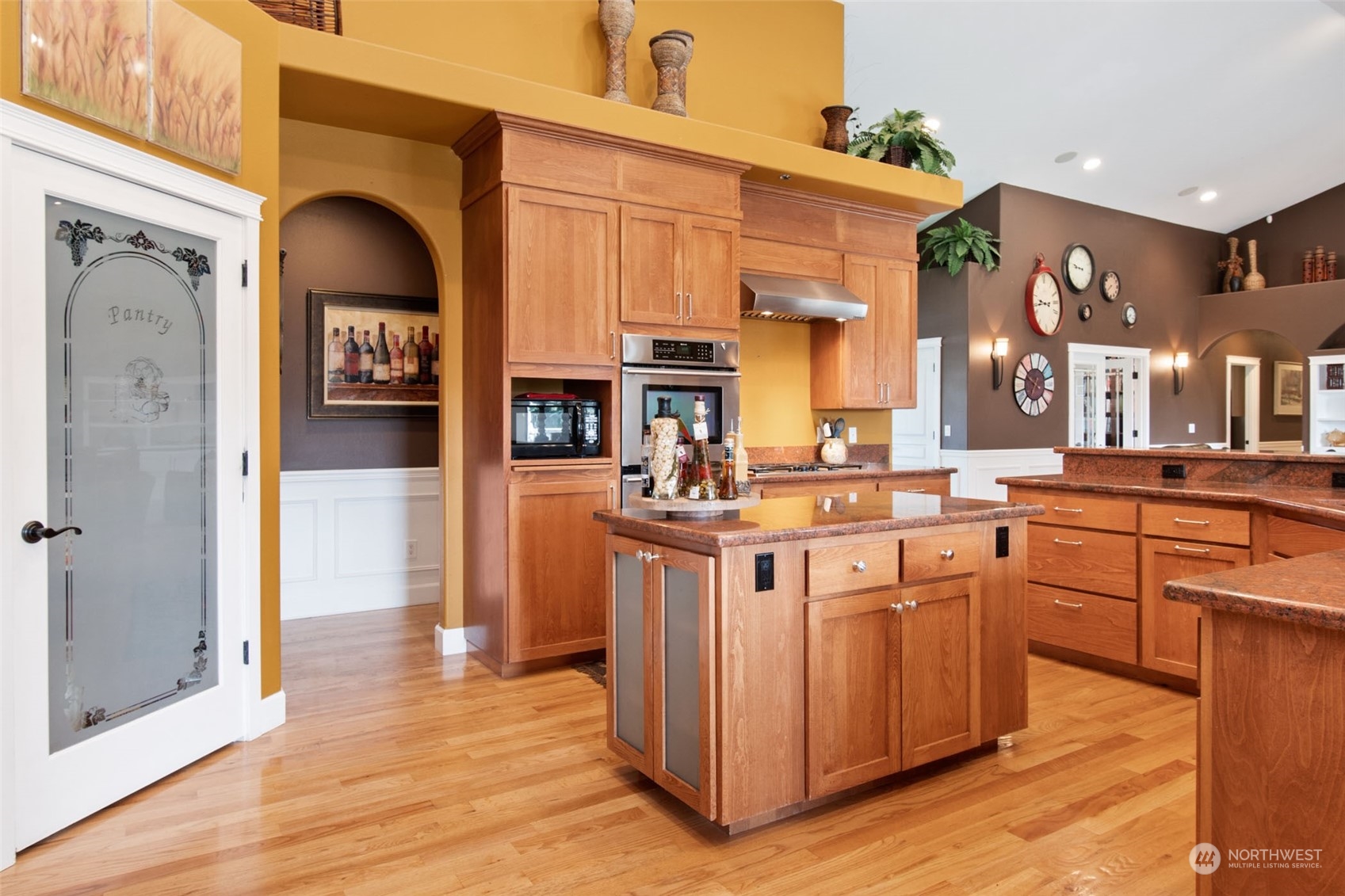 6504 263rd Street East Graham, WA 98338 - Photo 8 of 38 a kitchen with stainless steel appliances granite countertop a lot of counter top space and wooden floor