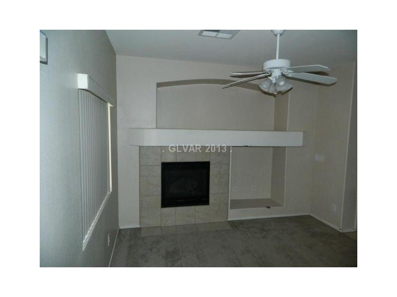 1553 Rusty Ridge Lane Henderson, NV 89002 - Photo 4 of 35 Living Room. COZY FIREPLACE IN THE LIVING ROOM, NOTICE THE MEDIA NICHE