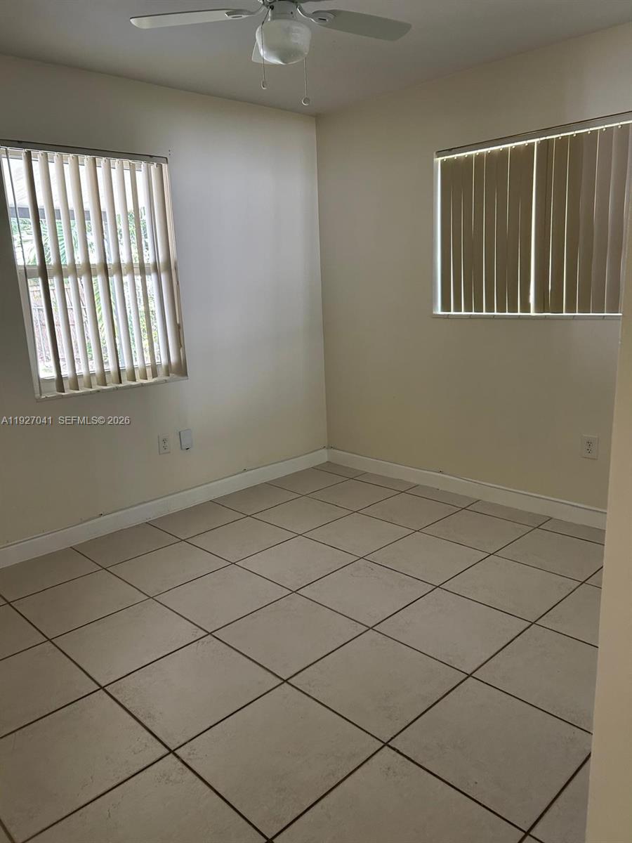 10011 Southwest 162nd Street Miami, FL 33157 - Photo 11 of 22 an empty room with windows