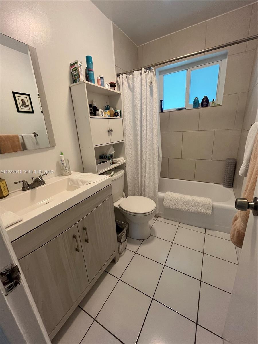 10011 Southwest 162nd Street Miami, FL 33157 - Photo 12 of 18 a bathroom with a sink toilet and shower