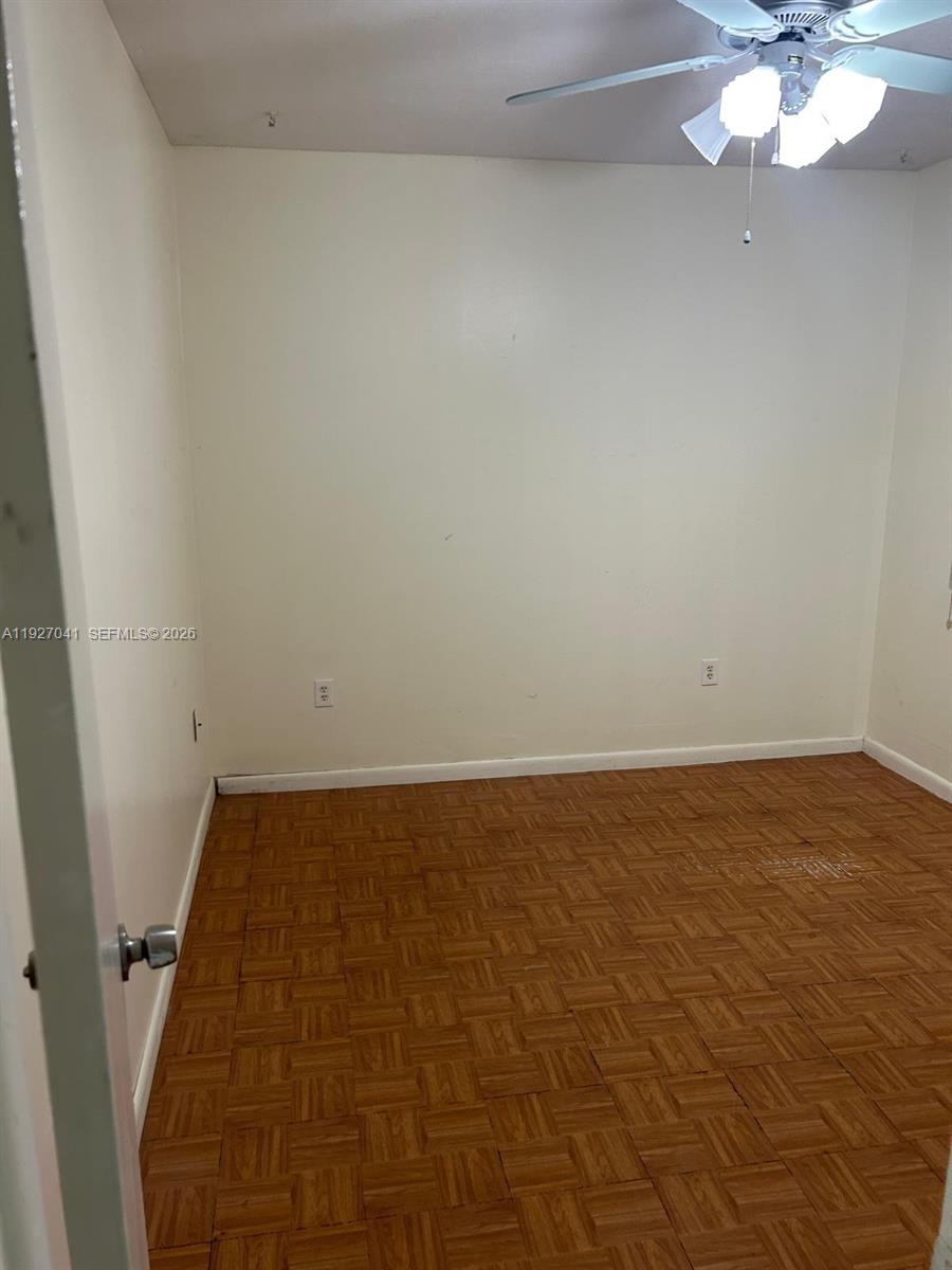 10011 Southwest 162nd Street Miami, FL 33157 - Photo 13 of 22 en empty room with fan