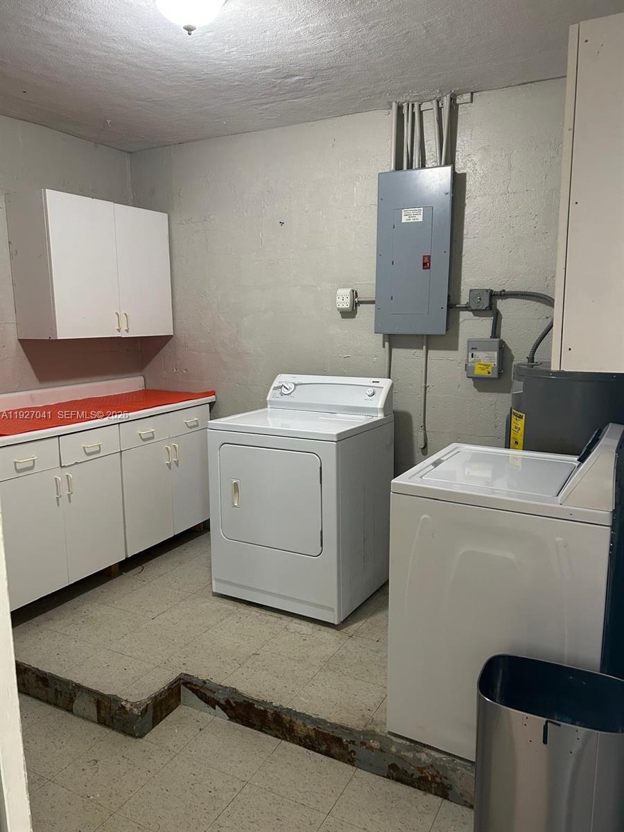 10011 Southwest 162nd Street Miami, FL 33157 - Photo 16 of 22 a utility room with dryer and washer