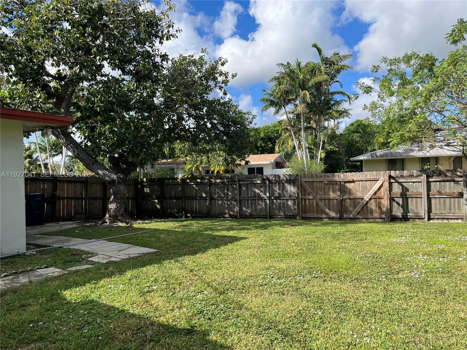 10011 Southwest 162nd Street Miami, FL 33157 - Photo 17 of 22 a view of a backyard