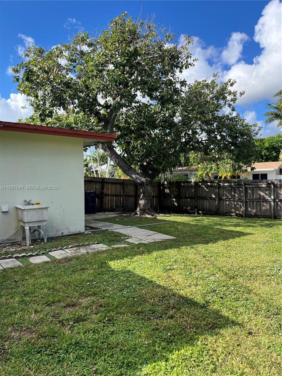 10011 Southwest 162nd Street Miami, FL 33157 - Photo 18 of 22 a backyard of a house with lots of green space