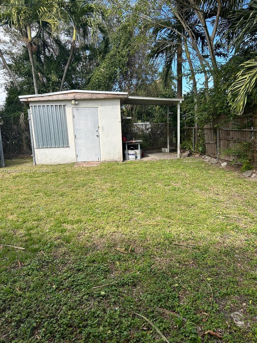10011 Southwest 162nd Street Miami, FL 33157 - Photo 21 of 22 a view of backyard with green space