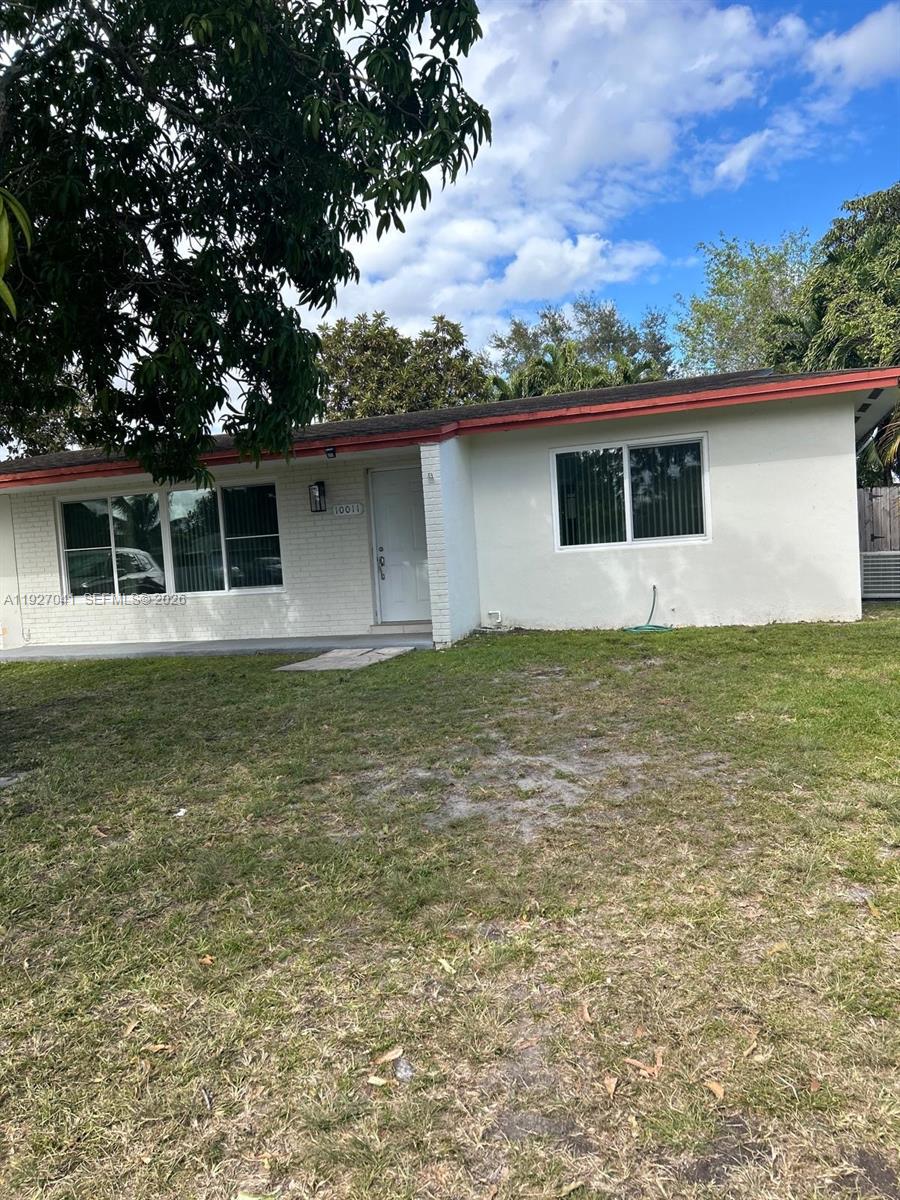 10011 Southwest 162nd Street Miami, FL 33157 - Photo 3 of 22 a house that has a tree in it