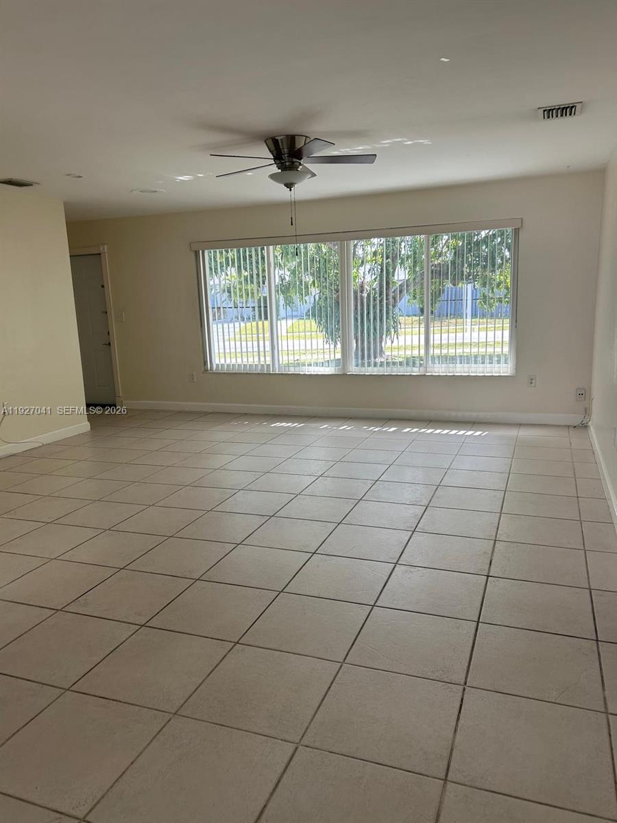 10011 Southwest 162nd Street Miami, FL 33157 - Photo 4 of 22 a view of an empty room with a window