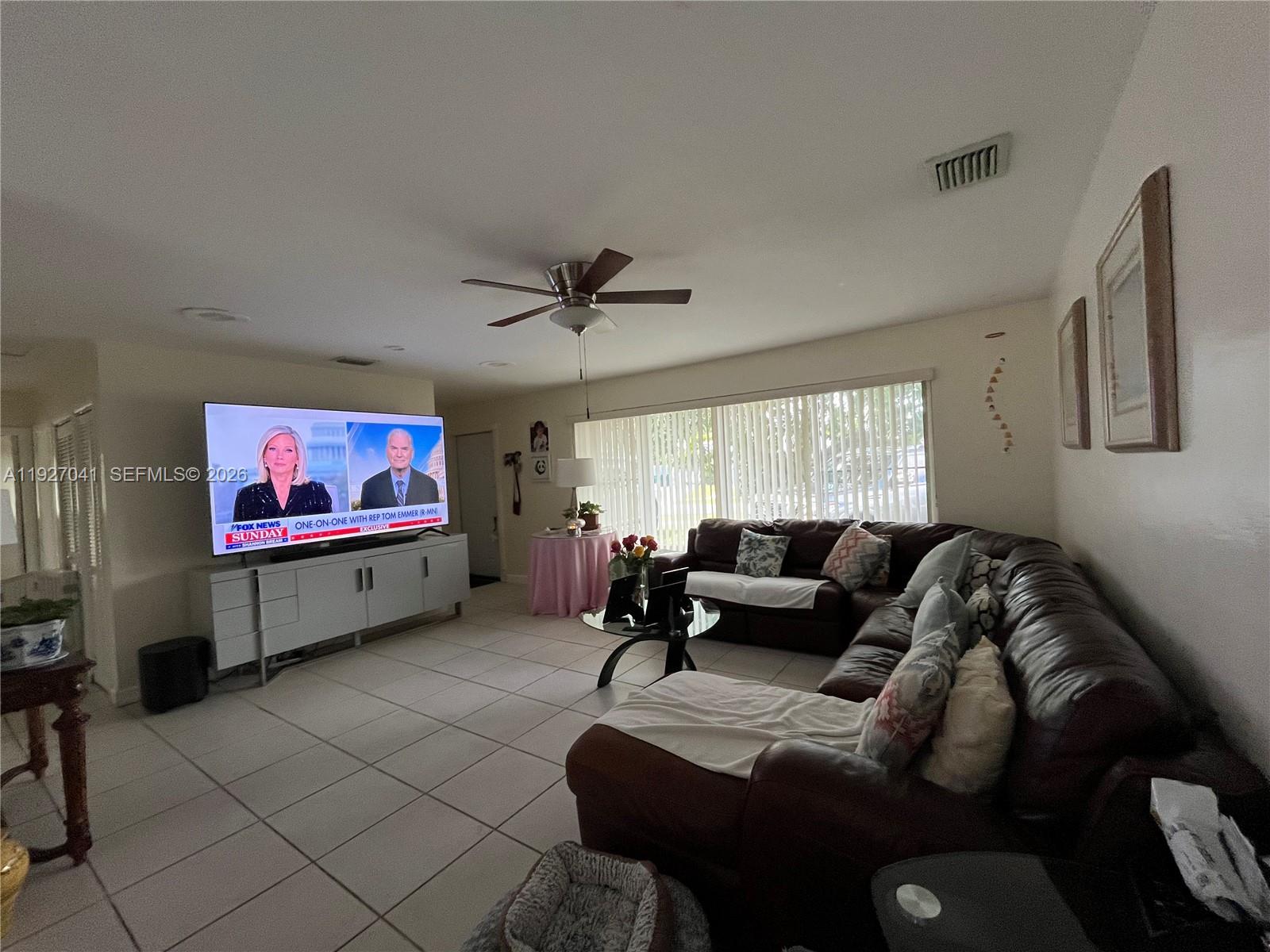10011 Southwest 162nd Street Miami, FL 33157 - Photo 5 of 18 a living room with furniture and a window